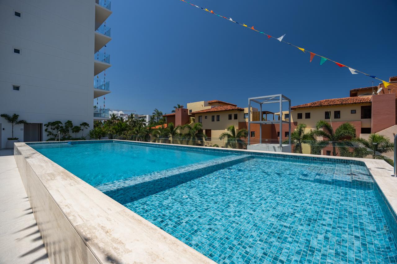 Rooftop infinity pool panorama over Banderas Bay and the Sierra Madre
