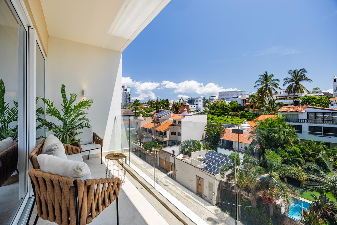 Private balcony with palms and Bucerías rooftops