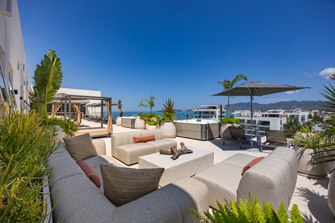 Rooftop sofa lounge with ocean panorama