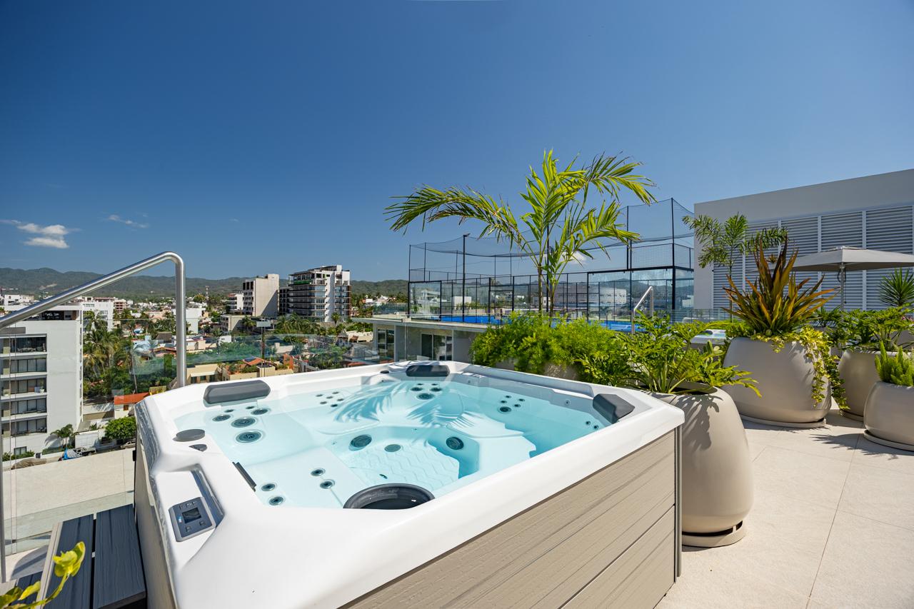 Second rooftop jacuzzi beside the pickleball court